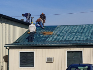 A Gassert Roofing team member performing a roof repair on a Lebanon home